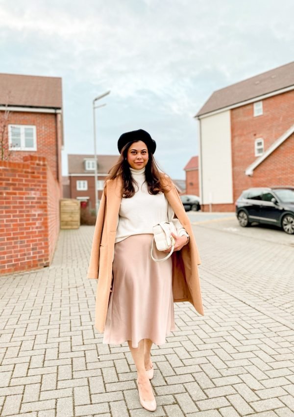 French Style dressing with neutral beige tones. Beret, satin skirt camel coat and a Bottega Veneta bag. Parisian style | french girl style