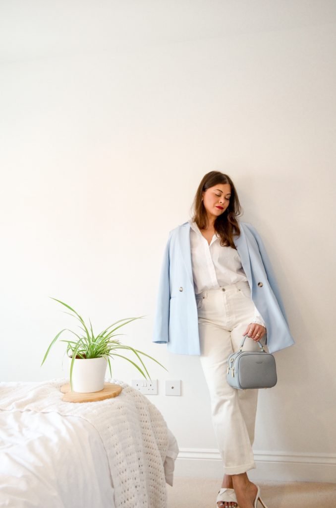 French style outfit with white shirt , white jeans straight jeans pale blue blazer bottega veneta mules with crossbody camera bag and red lips