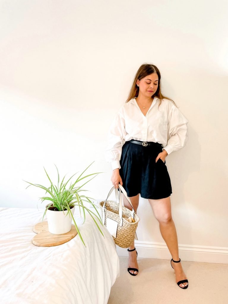 White shirt outfit with black shorts