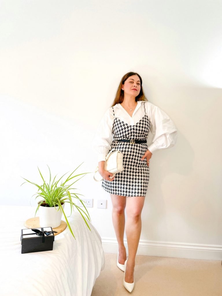 Houndstooth dress with a white shirt . Shirt dress styling.