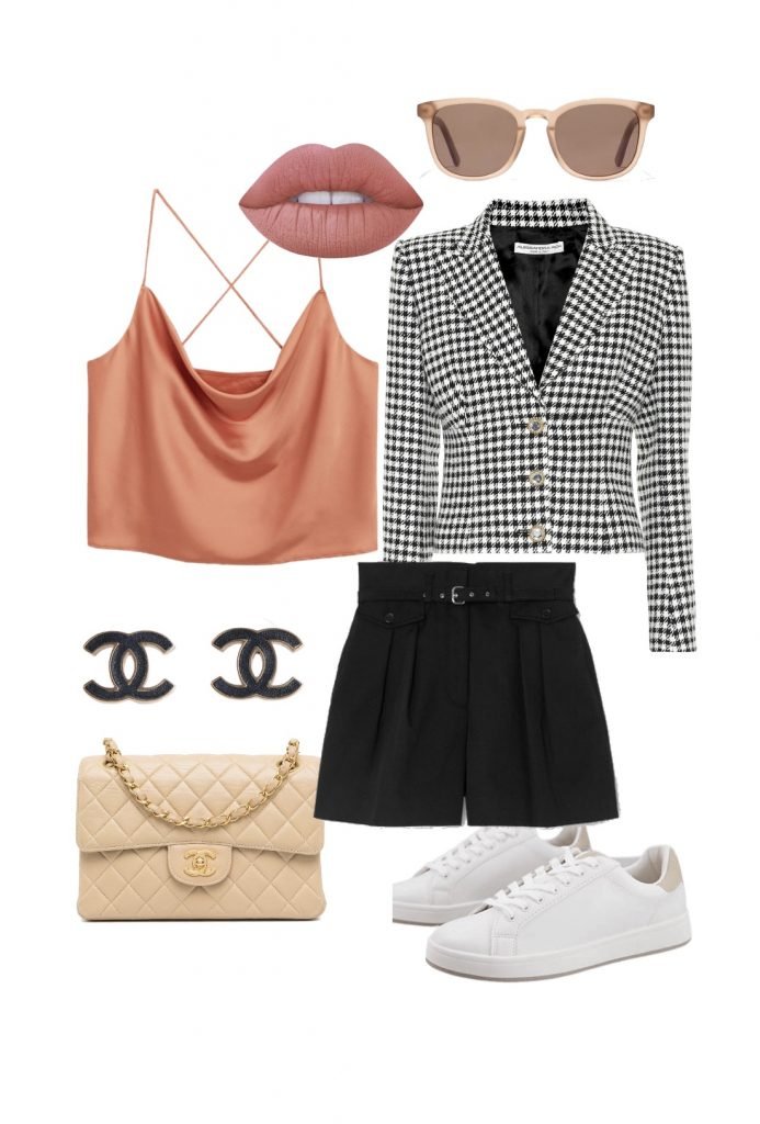 Pleated shorts and blazer with chanel bag and white trainers 