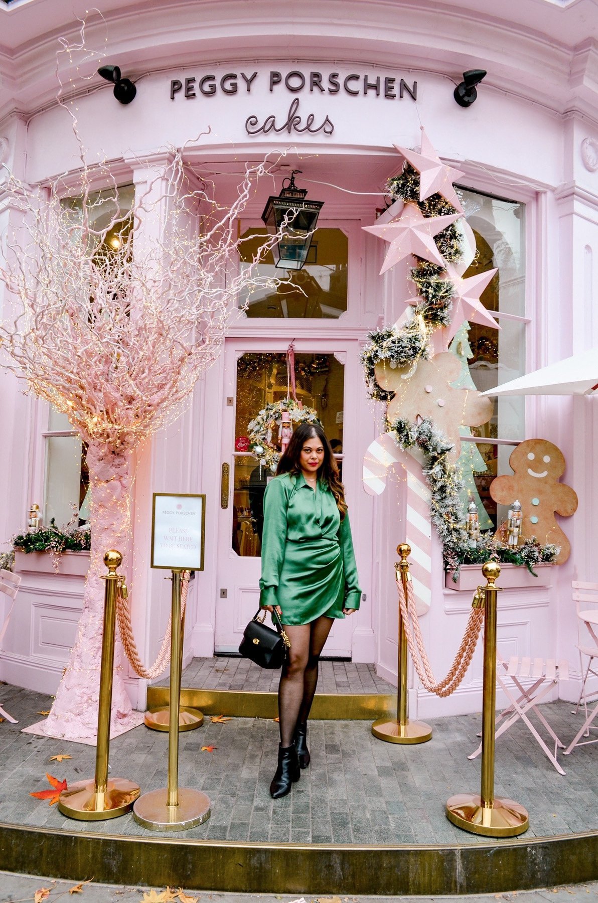 Peggy Porschen most instagrammable places in London. Peggy Porschen. Woman in green satin dress. Made in Chelsea cast, Fur coat, Green zara dress Chanel bag 