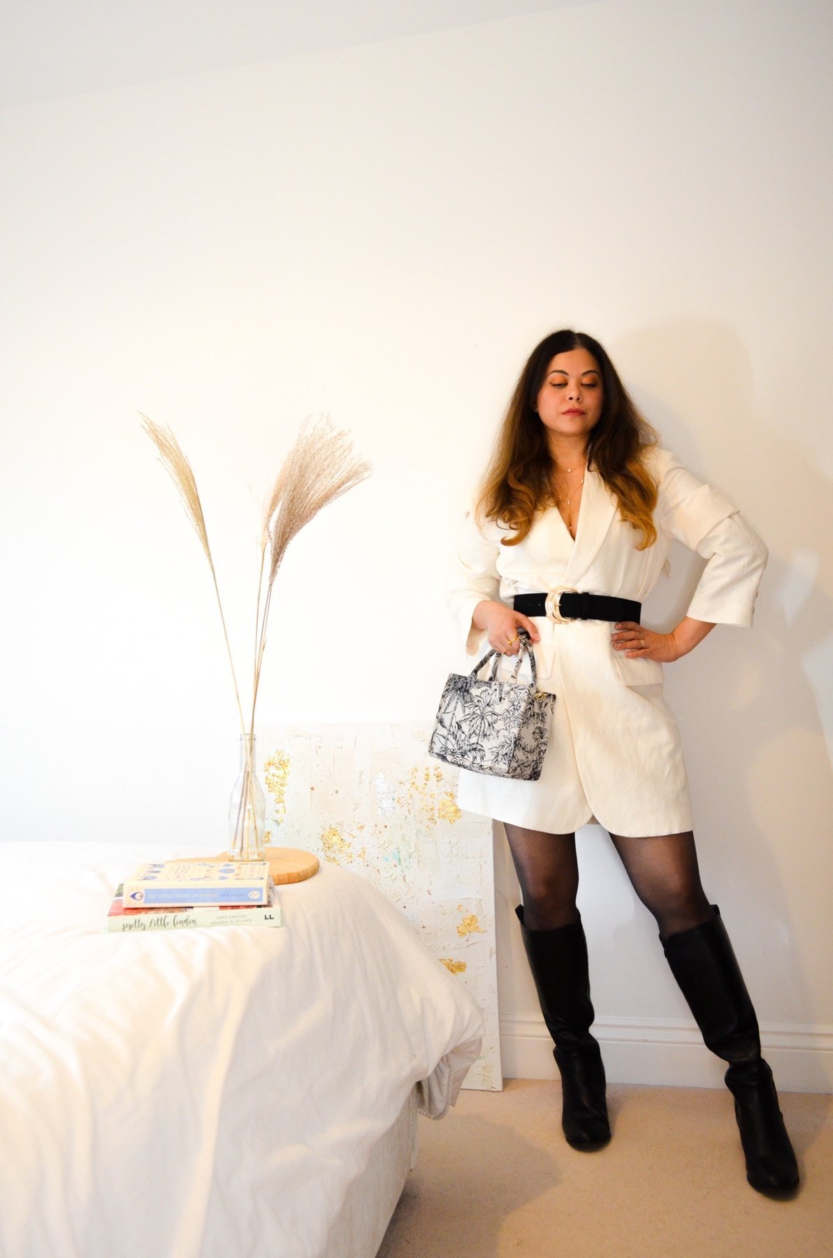 White blazer dress with oversized blazer and white coat and long boots. 15 winter outfits 