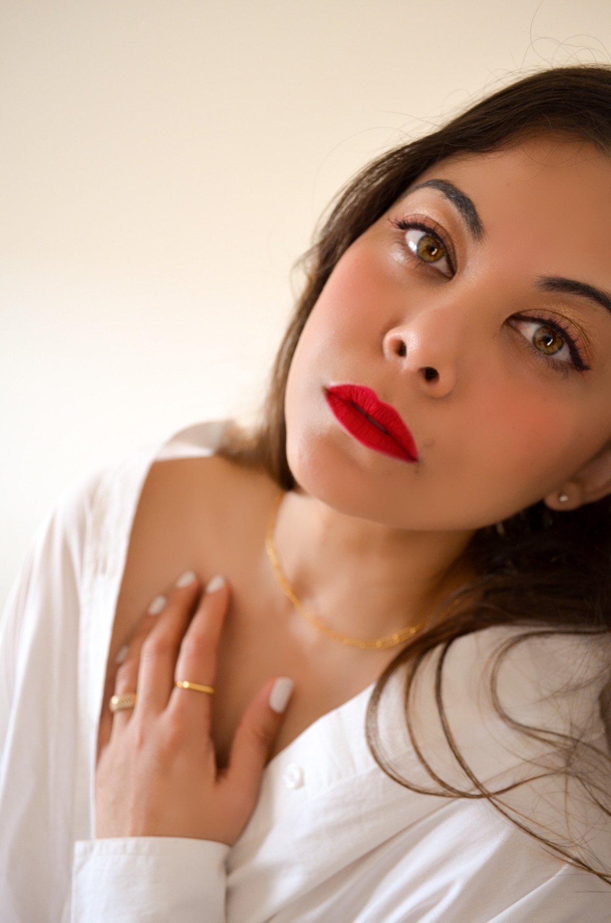 Monica Vinader jewellery on lady with red lips and white shirt. Portrait shot ideas 