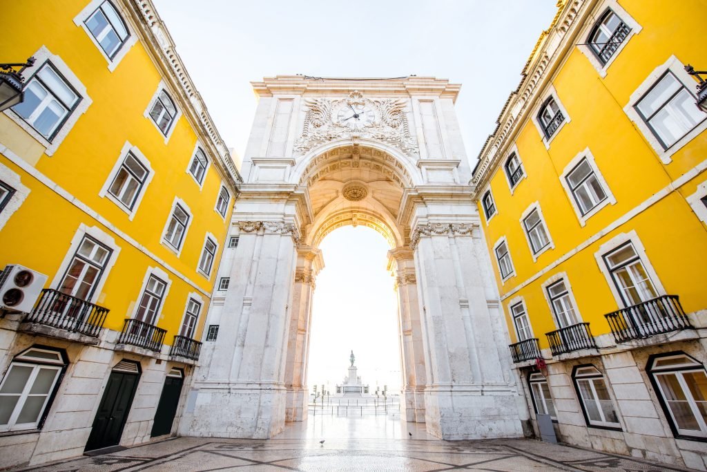 View on the Triumphal arch on the Commerce square during the sunrise in Lisbon city, Portugal