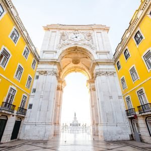 View on the Triumphal arch on the Commerce square during the sunrise in Lisbon city, Portugal