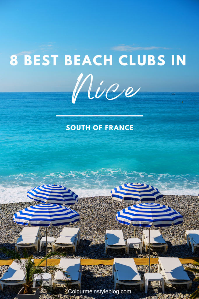A beautiful beach club in the south of France with blue stripe umbrellas and white sunbeds | 8 best beach clubs in Nice, France. 