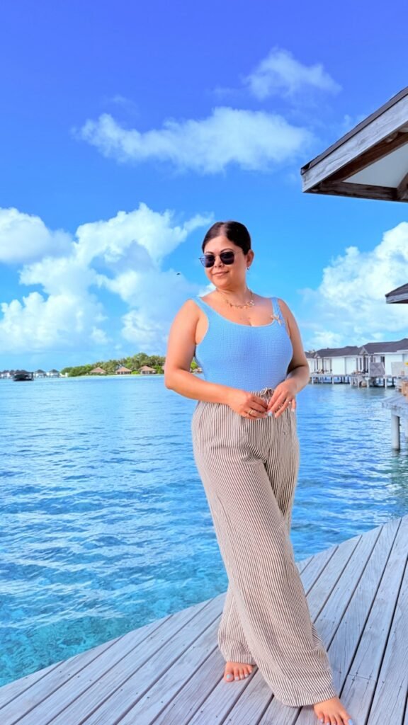 Blue swimsuit with brown stripe trousers - beach outfit