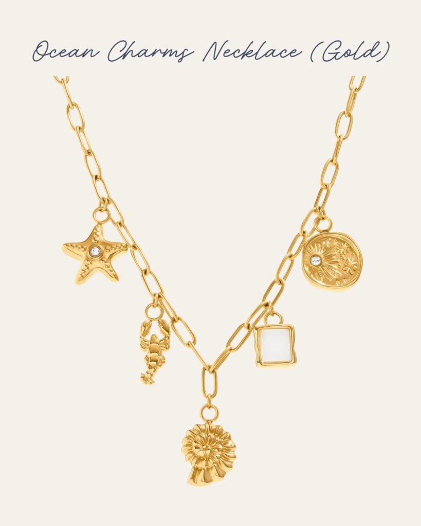 A gold-plated charm necklace features five ocean-inspired charms (a starfish, lobster, shell, moonstone and molten coin), each with its own playful character.
