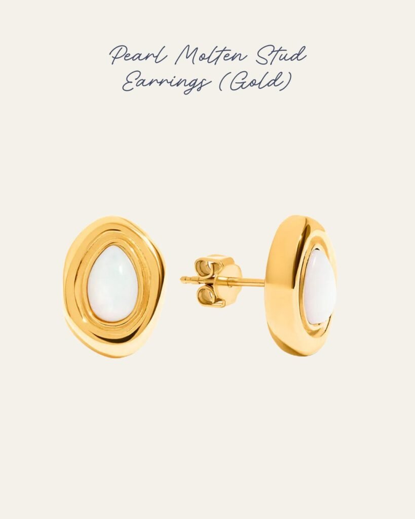 Oval stud earrings in gold with a molten pearl centre. 